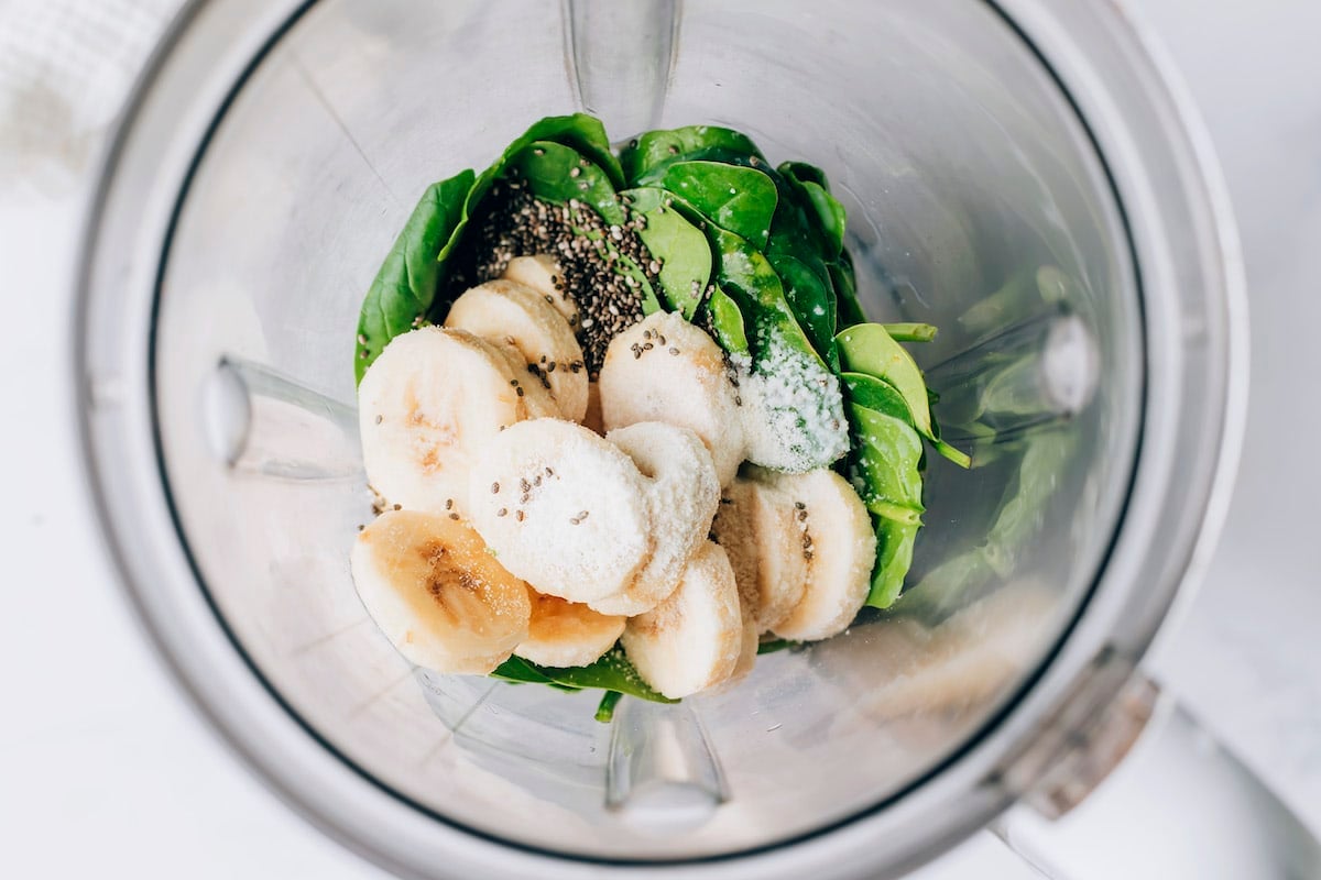 Frozen banana slices, vanilla protein powder, vanilla almond milk, spinach and chia seeds in a high powered blender.