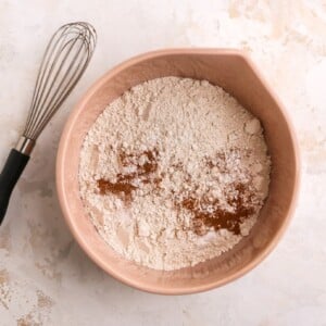 Flour, baking powder, baking soda, cinnamon and salt combined in a large bowl.