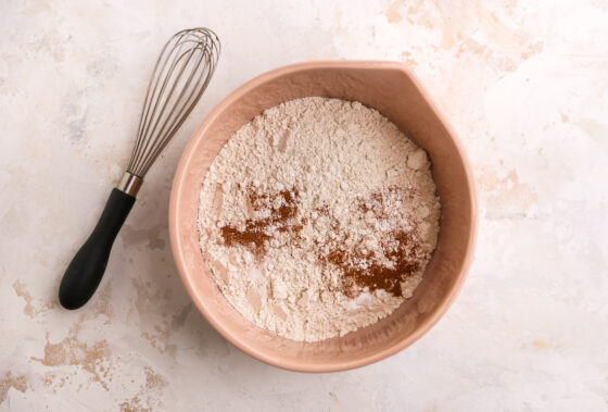 Flour, baking powder, baking soda, cinnamon and salt combined in a large bowl.