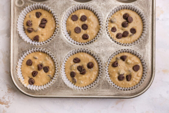 Batter poured evenly into 6 paper lined muffin tins.