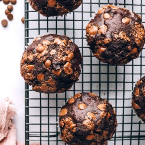 A birds eye view of 4 chocolate chip muffins on a wire rack.