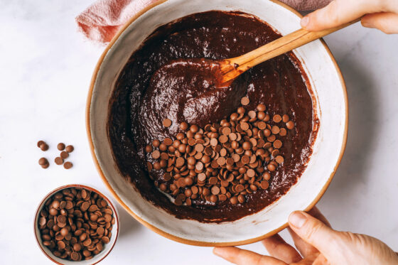 The wet and dry ingredients have been mixed together and chocolate chips have been added to the batter.