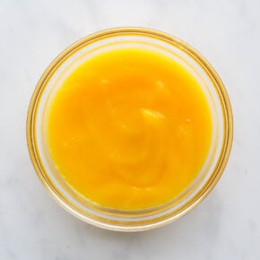 A small glass bowl containing mango puree.