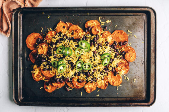 Sweet potato rounds topped with black beans, sprinkled with cheese and topped with jalapeño slices.