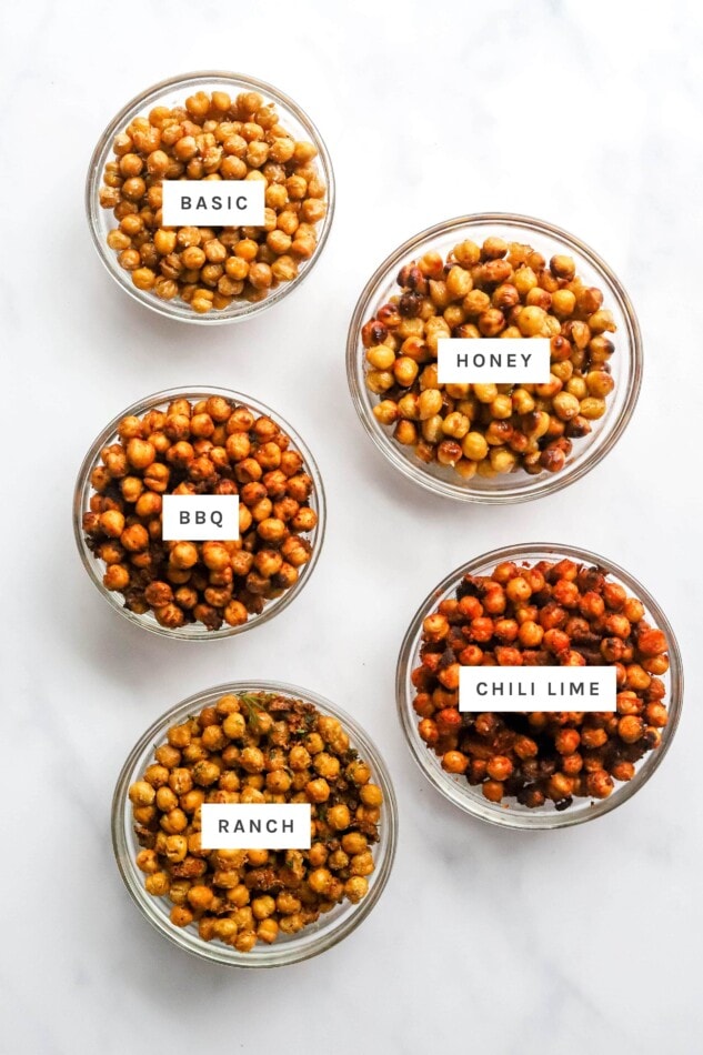 Five bowls of different flavored seasoned air fried chickpeas: basic, honey, bbq, chili lime and ranch.