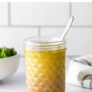 Mason jar full of homemade lemon salad dressing.