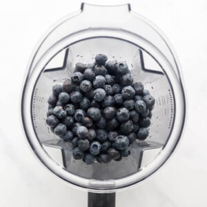 Blueberries in a blender.