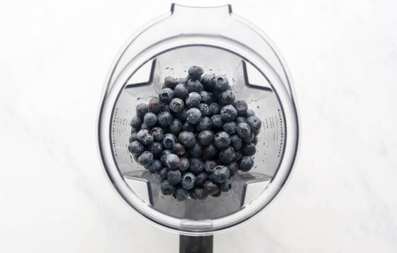 Blueberries in a blender.