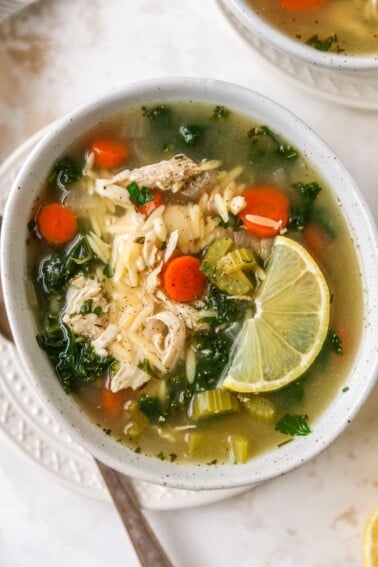 A bowl of lemon chicken orzo soup.