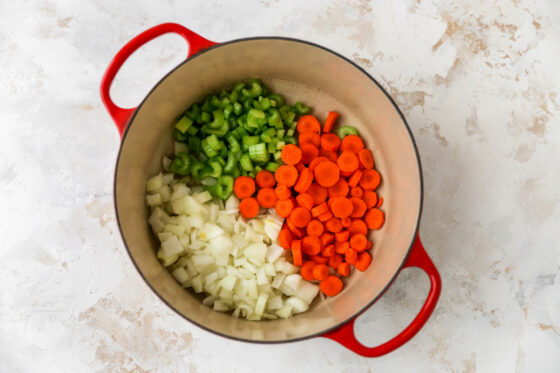 Onion, carrots and celery in a Dutch oven.