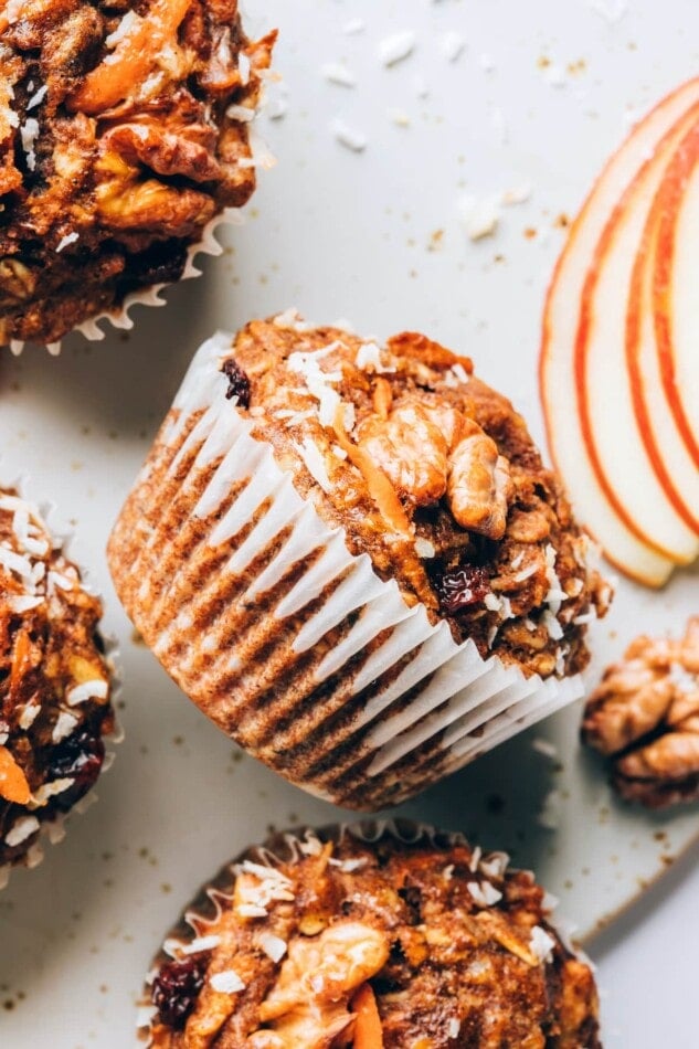 Morning glory muffins wrapped in paper liners.