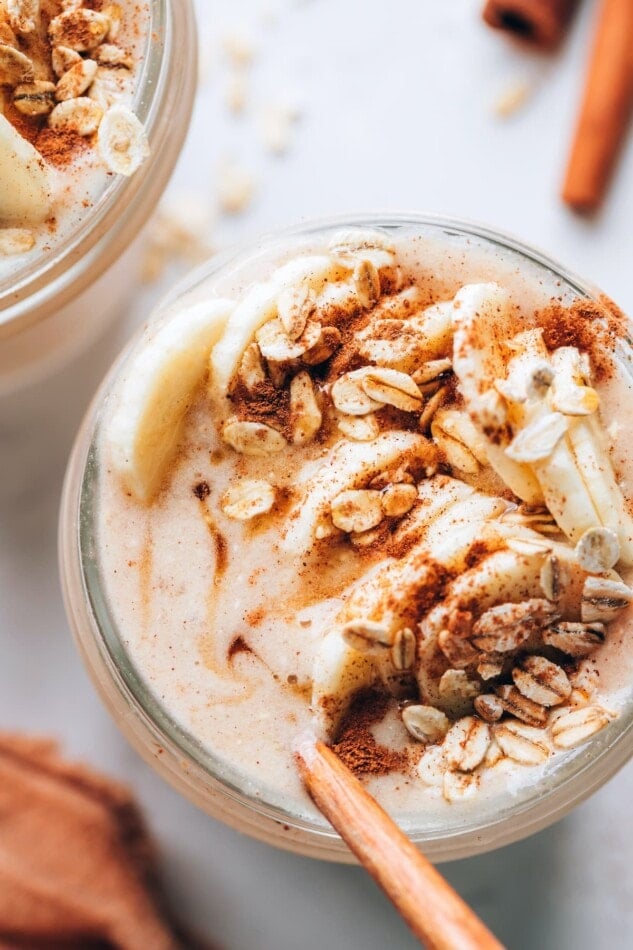 An overhead view of an oatmeal smoothie in a mason jar.