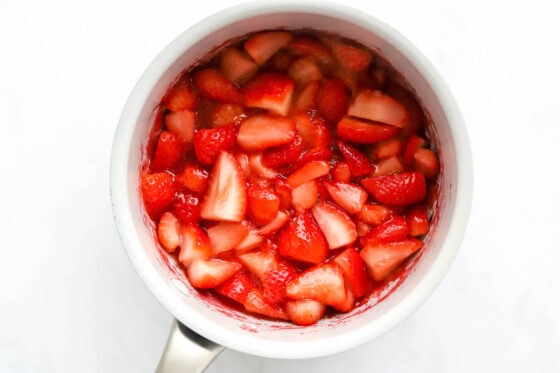 Simmered strawberries in a pot.