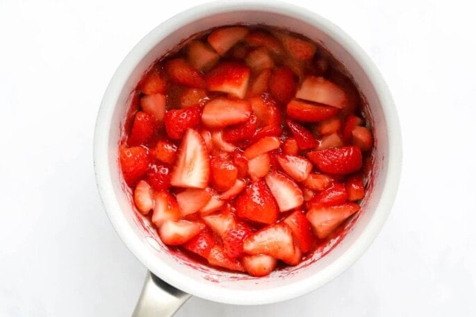 Simmered strawberries in a pot.
