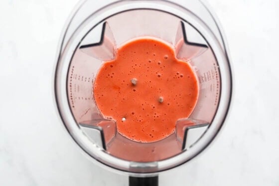 Simmered strawberry puree in a blender.