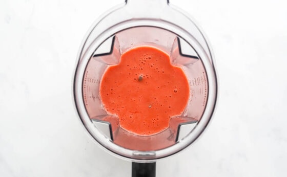 Steamed strawberry puree in a blender.