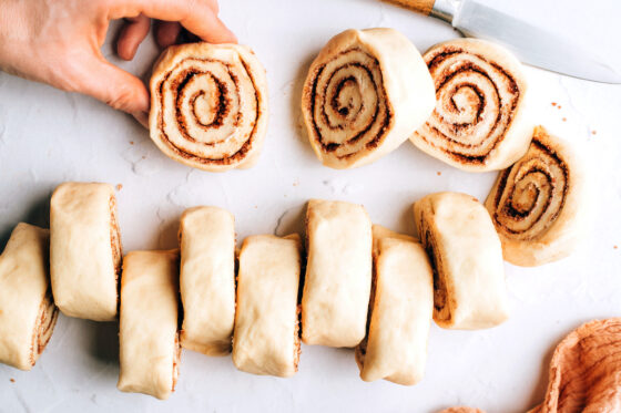 Slicing the log into 12 individual rolls.