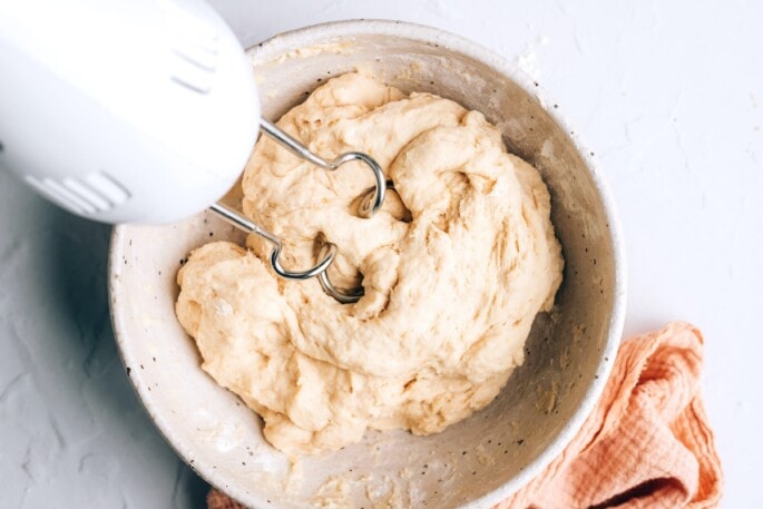 Dough forming in a mixing bowl.