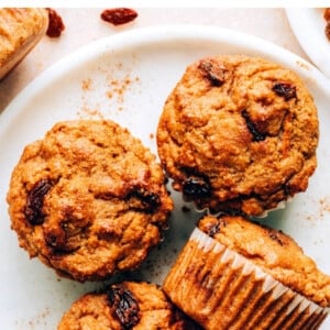 Carrot raisin muffins on a plate.