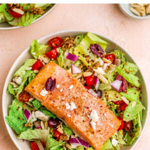 A salad bowl with mediterranean salmon salad.