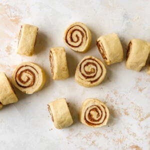 12 cinnamon rolls after being rolled up and cut.