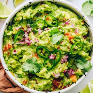 An overhead view of a serving bowl of guacamole.