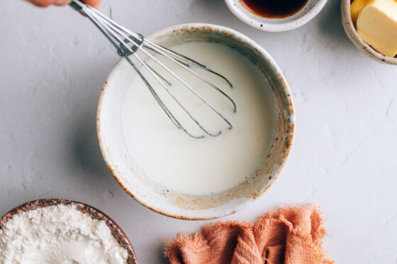 Almond milk and apple cider vinegar mixed together in a bowl.