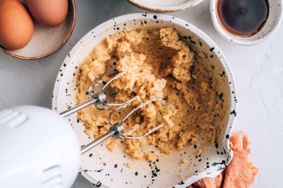 Sugar and butter whipped together in a bowl.