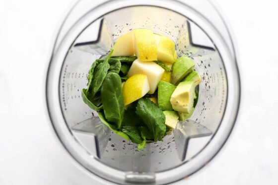 Pear, avocado, coconut water, baby spinach and mint in a blender.