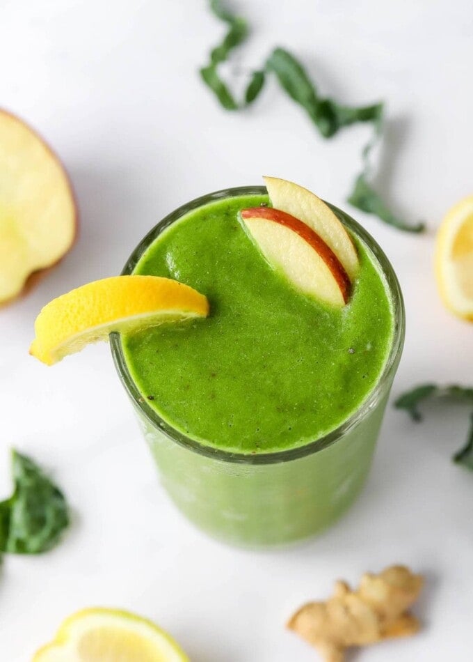 An over head view of a drinking glass containing recovery smoothie.