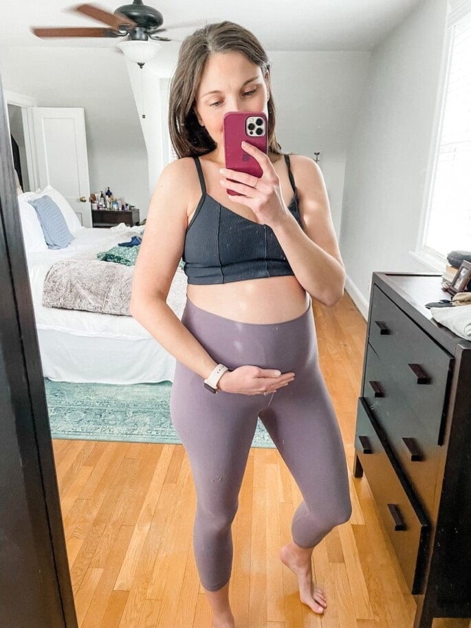 21 weeks pregnant woman with workout clothes on.