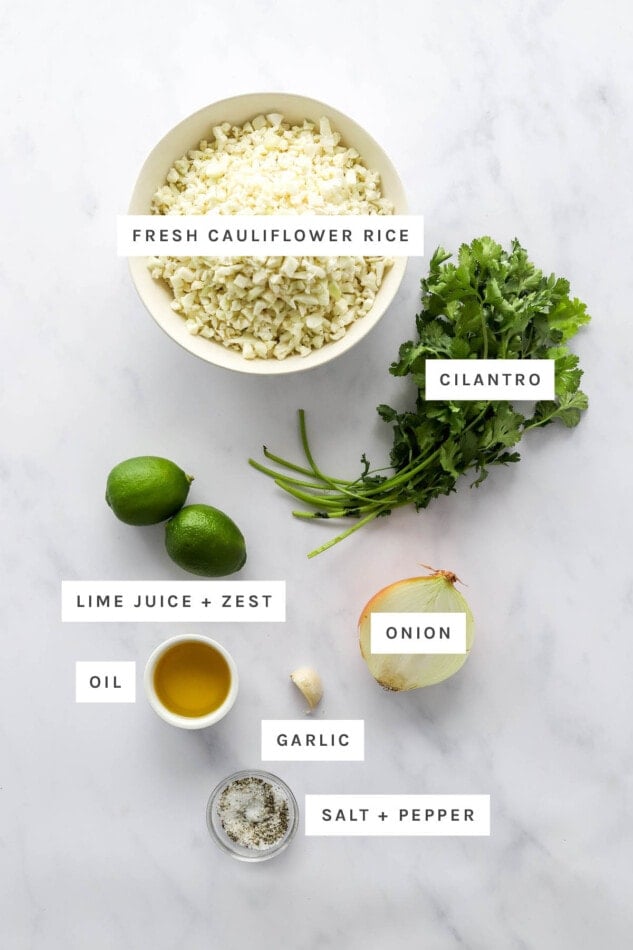 Ingredients measured out to make cilantro lime cauliflower rice: cauliflower rice, cilantro, limes, onion, oil, garlic, salt and pepper.