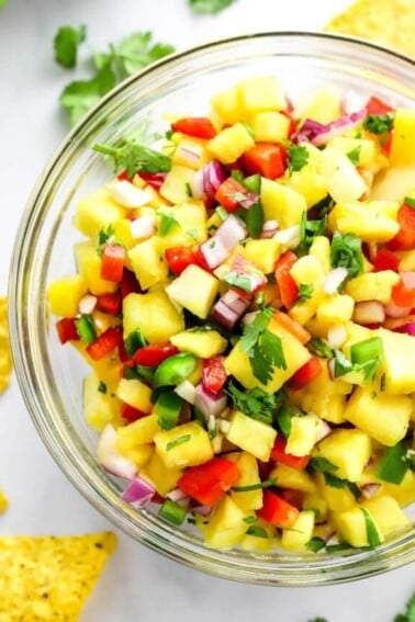 A closeup of pineapple salsa in a serving bowl.