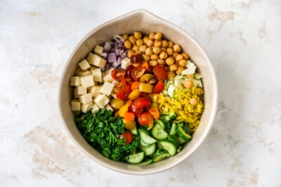 A bowl containing ingredients for Italian chopped salad.
