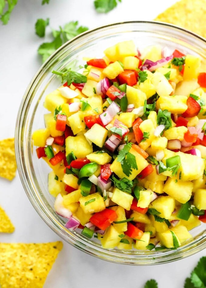 A closeup of pineapple salsa in a serving bowl.