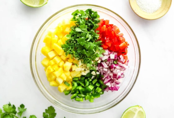 Ingredients for pineapple salsa in a mixing bowl.