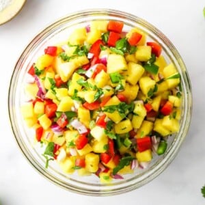 Pineapple salsa in a mixing bowl.