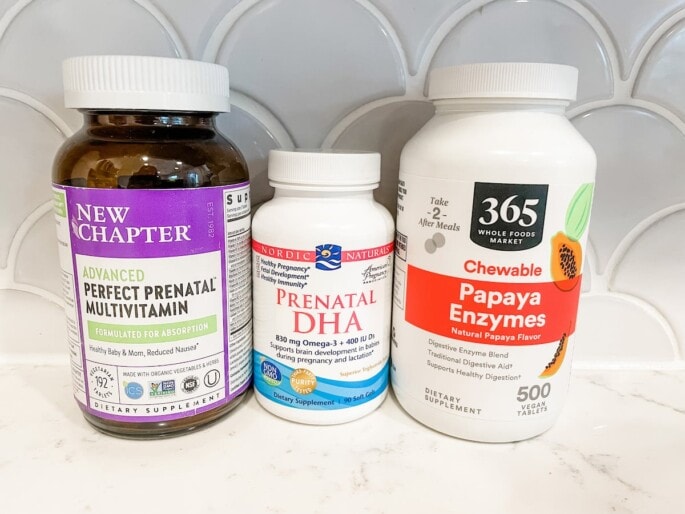 Three bottles of vitamins: perfect prenatal, prental DHA and papaya enzyme.