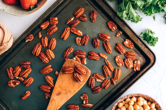 Roasting pecans on a sheet pan.