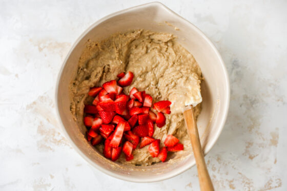 Strawberries folded into the muffin batter.