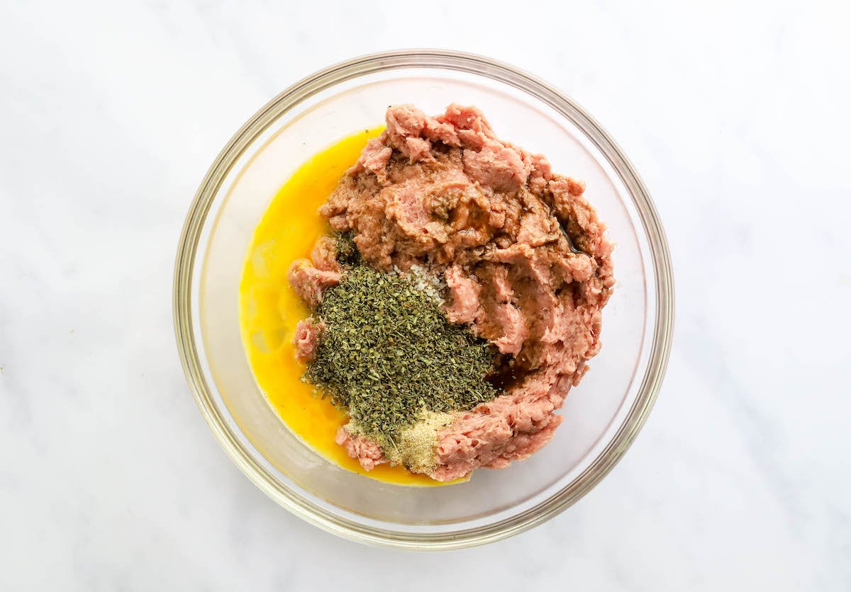 Ground turkey, egg, Italian seasoning, tamari, garlic, sea salt and pepper in a large bowl.