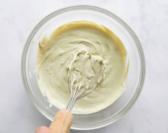 Whisking together ingredients for vanilla protein pudding.