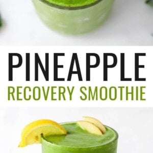 A drinking glass filled with recovery smoothie, topped with lemon and apple wedges.