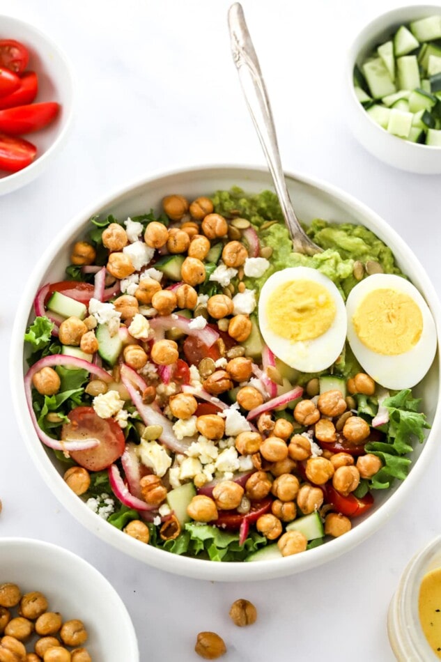 Overhead view of a mashed avocado bowl.