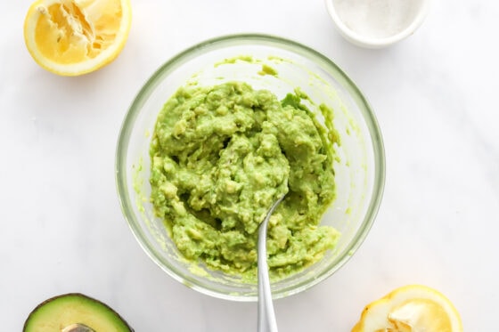 Mashed avocado in a bowl.