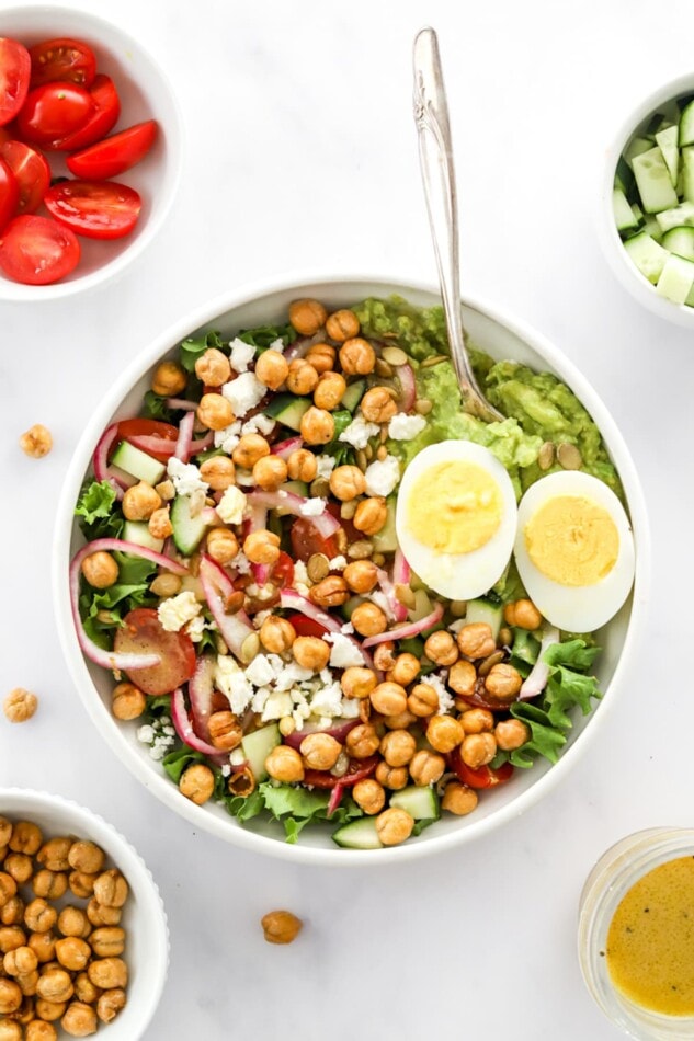 Overhead view of a mashed avocado bowl.