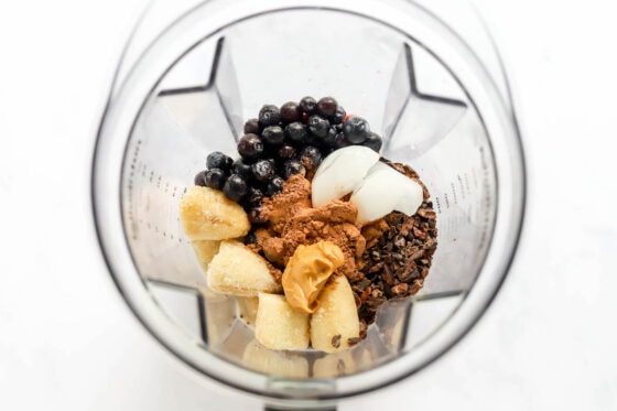 Ingredients for cacao smoothie in a blender.