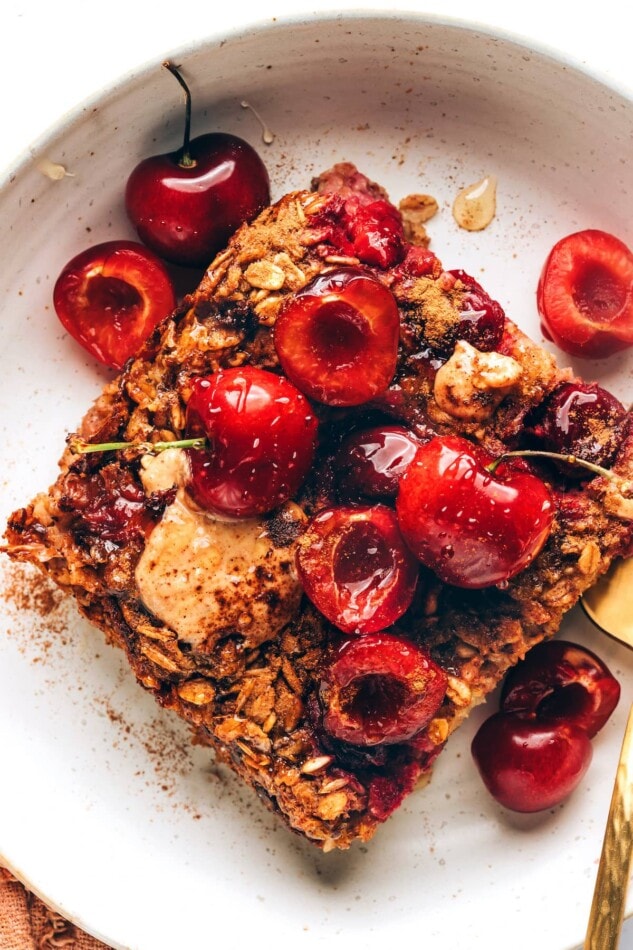 Close up of a serving of cherry baked oatmeal on a plate.