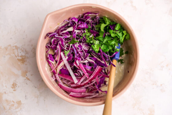 Honey Dijon Cabbage Slaw ingredients in a bowl.