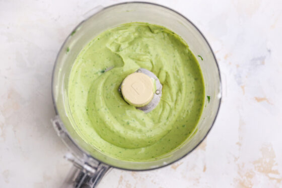 Avocado crema in a food processor.